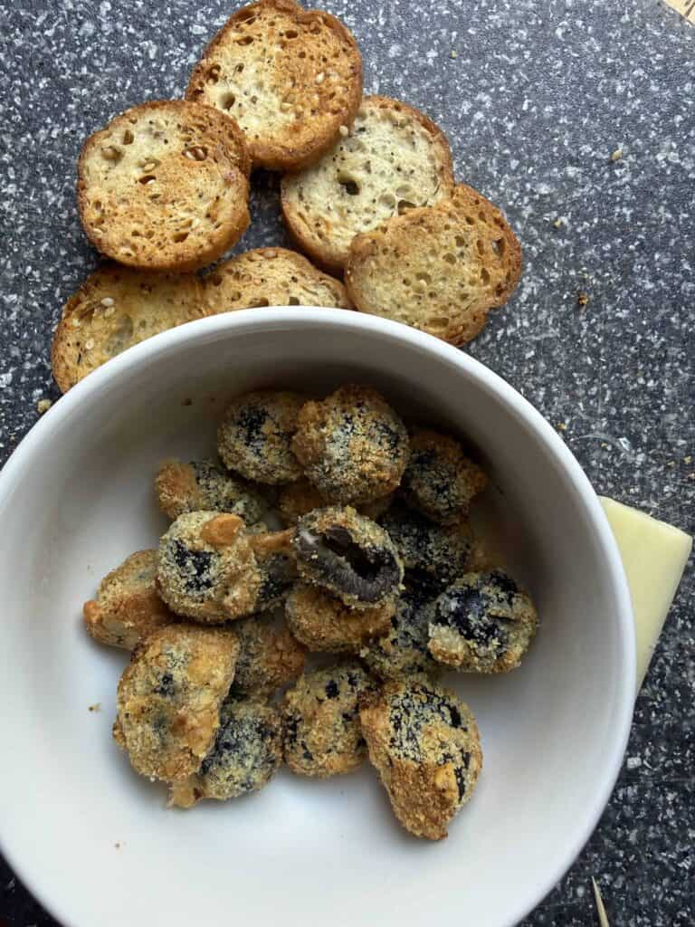 ed olives in a bowl in the background.