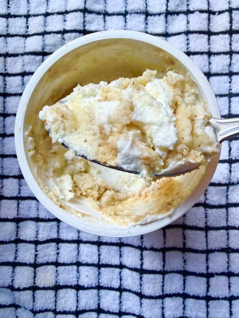 No bake low sugar yogurt cheesecake made with Greek yogurt and low-sugar cookies, showing a creamy cheesecake-like texture with a spoon