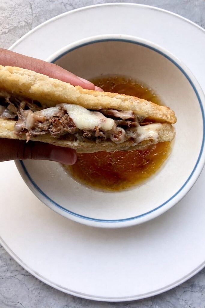 Low carb French dip sandwich made with chuck roast and beef broth au jus