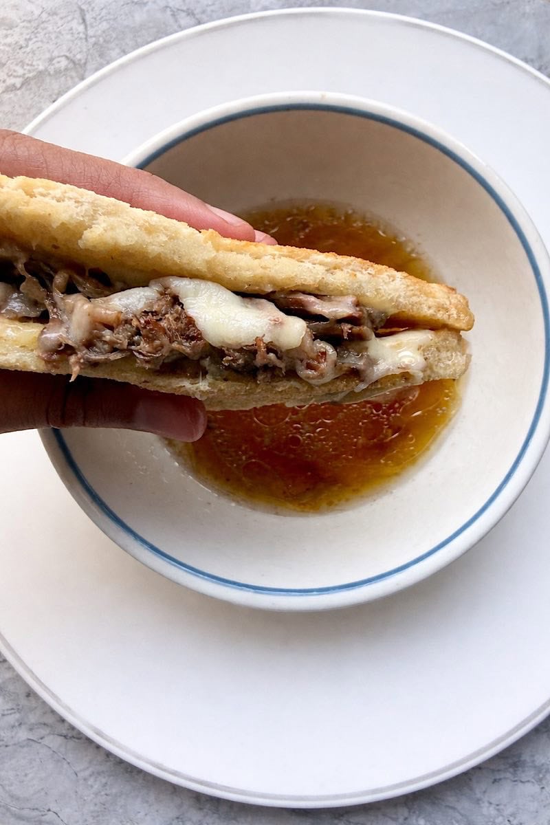Low carb French dip sandwich made with chuck roast and beef broth au jus