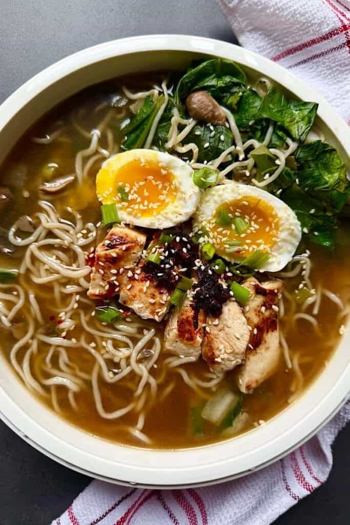 Easy homemade chicken ramen with soft-boiled egg, bok choy, mushrooms, and shirataki noodles in garlic broth